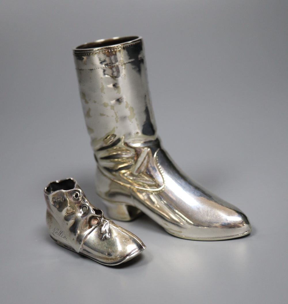 A silver novelty boot pin cushion, Levi & Salaman, Birmingham 1909 (lacking cushion),55m and a plated boot vesta